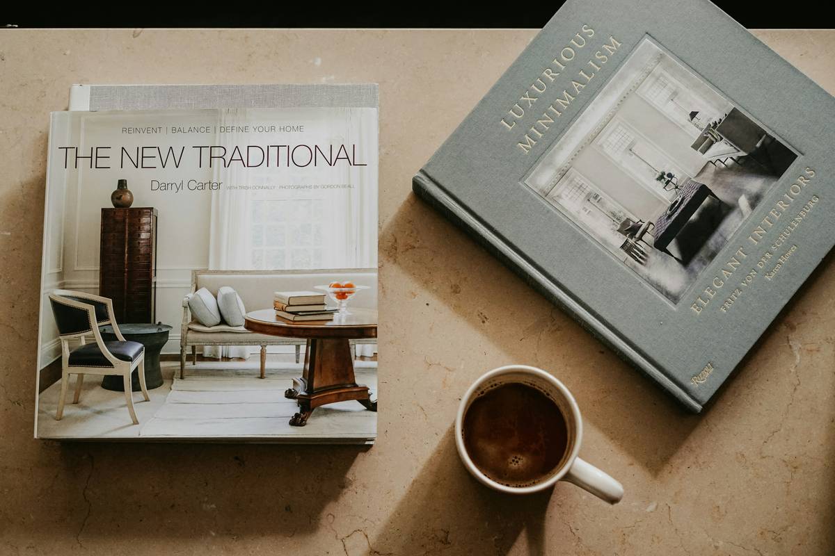 Open industrial furniture design book showing loft layout sketches and material swatches